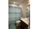 Bathroom with shower/tub combo, single vanity, and decorative shower curtain at 2133 Tupelo Grove Ln, Gastonia, NC 28054