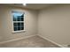 Unfurnished bedroom with neutral paint, carpeted floors, and window at 2133 Tupelo Grove Ln, Gastonia, NC 28054