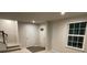 Bright entryway with carpeted stairs and access to an adjacent room at 2133 Tupelo Grove Ln, Gastonia, NC 28054