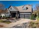 Two-story house with gray siding, two-car garage, and American flag at 2221 Lexington St, Belmont, NC 28012