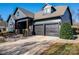 Two-story house with gray siding, two-car garage, and landscaped yard at 2221 Lexington St, Belmont, NC 28012