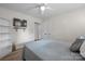 Bedroom featuring a bed, ceiling fan, shelves, and wood-look flooring at 2654 Saddlewood Cir, Concord, NC 28027