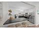 Kitchen with breakfast bar, stainless steel appliances, and dark gray cabinets at 2654 Saddlewood Cir, Concord, NC 28027