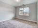 Well-lit bedroom with neutral walls and carpet flooring at 3011 Whispering Creek Dr # 145, Indian Trail, NC 28079