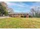 Brick ranch house with carport and large yard at 302 Churchill Dr, Kings Mountain, NC 28086