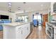 Bright kitchen featuring white cabinets, stainless steel appliances, and an island with sink at 3532 Tully Ave, Kannapolis, NC 28081