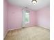 Charming bedroom with pink walls and a window at 508 N Portman Ln, Fort Mill, SC 29708