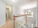 Upstairs hallway with a staircase and chandelier at 508 N Portman Ln, Fort Mill, SC 29708