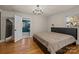 Main bedroom with hardwood floors and ensuite bathroom at 5501 Chedworth Dr, Charlotte, NC 28210