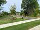 Landscaped path with stone accents leading through the community at 6256 Culbert St # 187, Harrisburg, NC 28075