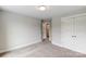 Spacious bedroom with double doors and access to a bathroom at 6288 Culbert St # 191, Harrisburg, NC 28075