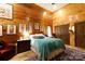 Spacious bedroom with wood walls and teal bedding at 633 Weston Acres Rd, Fort Lawn, SC 29714