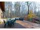 Deck with table and chairs overlooking a wooded area at 633 Weston Acres Rd, Fort Lawn, SC 29714