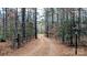 Private gated entrance to wooded property at 633 Weston Acres Rd, Fort Lawn, SC 29714