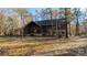Rustic log cabin home with stone accents, nestled in a wooded setting at 633 Weston Acres Rd, Fort Lawn, SC 29714