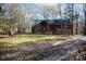Stunning log cabin home with a spacious front yard and wooded backdrop at 633 Weston Acres Rd, Fort Lawn, SC 29714
