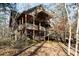 Multi-level log cabin home with expansive decks and wooded views at 633 Weston Acres Rd, Fort Lawn, SC 29714