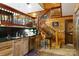Kitchen with breakfast bar, wood cabinets, and a staircase at 633 Weston Acres Rd, Fort Lawn, SC 29714