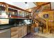 Kitchen with breakfast bar, wood cabinets, and a staircase at 633 Weston Acres Rd, Fort Lawn, SC 29714
