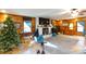 Living room featuring a cozy fireplace and wood walls at 633 Weston Acres Rd, Fort Lawn, SC 29714