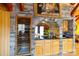 Wet bar with stone accent wall and wine storage at 633 Weston Acres Rd, Fort Lawn, SC 29714