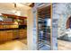 Built-in wine cellar with glass door, adjacent to kitchen at 633 Weston Acres Rd, Fort Lawn, SC 29714