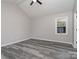 Spacious bedroom featuring hardwood floors and a ceiling fan at 7208 Rockwood Forest Ln, Charlotte, NC 28212