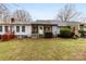 Townhome's backyard with a screened porch and grassy area at 805 Prince Albert Ct, Statesville, NC 28677