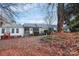 Community of homes showcasing a shared backyard space with autumn leaves at 805 Prince Albert Ct, Statesville, NC 28677