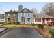 Front view of a charming townhome with gray exterior and landscaping at 805 Prince Albert Ct, Statesville, NC 28677