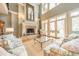 Bright living room featuring a fireplace and access to the outdoors at 8215 Buena Vista Dr, Denver, NC 28037