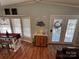 Bright dining area with large windows, access to the outdoors, and holiday decor at 108 Elm St, New London, NC 28127