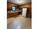 Functional kitchen featuring wood cabinets and tiled floor at 112 Adcock St, Belmont, NC 28012