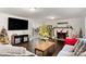 Living room with Christmas trees, fireplace and large TV at 1503 Davis Park Rd, Gastonia, NC 28052