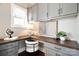 Home office with built-in corner desk and gray cabinets at 17714 Meadow Bottom Rd, Charlotte, NC 28277