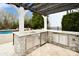 Outdoor kitchen with granite countertops, stainless steel appliances, and pergola at 17714 Meadow Bottom Rd, Charlotte, NC 28277