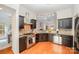 Modern kitchen with stainless steel appliances and granite countertops at 19534 Dufour Ct, Cornelius, NC 28031