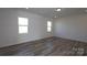 Bright bedroom with hardwood floors and two large windows at 2078 Van Buren Rd, Sherrills Ford, NC 28673