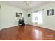 Bedroom with hardwood floors, window, and home office setup at 3203 Bentley Dr, Lancaster, SC 29720