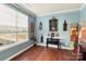 Bright home office features hardwood floors, window seating, and decorative wall art at 4805 Sandtyn Dr, Waxhaw, NC 28173