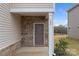 Front entrance with brick facade and covered porch at 509 Olympia Way, York, SC 29745