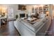 Bright living room with fireplace, built-in shelving, and hardwood floors at 5525 Providence Glen Rd, Charlotte, NC 28270