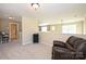 A second view of the carpeted loft area with a bathroom entrance at 6307 Cory Bret Ln, Charlotte, NC 28278