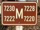 Brown address marker with the numbers 7220, 7222, 7228, and 7230 at 7220 Winery Ln, Charlotte, NC 28227