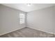 Bright bedroom with neutral walls and carpeted floors at 8108 Downy Oak Ln, Charlotte, NC 28269