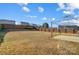 Large backyard with wooden fence, gazebo, and grassy area at 9315 Ames Hollow Rd, Charlotte, NC 28216