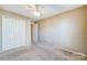 Bright bedroom with double door closet and ceiling fan at 9315 Ames Hollow Rd, Charlotte, NC 28216