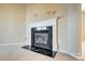 Living room fireplace with white mantel and black hearth at 9315 Ames Hollow Rd, Charlotte, NC 28216