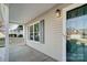 Covered front porch with gray siding and white railing at 9315 Ames Hollow Rd, Charlotte, NC 28216