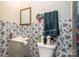 Small bathroom with floral wallpaper and shower at 1009 Spann St, Shelby, NC 28150